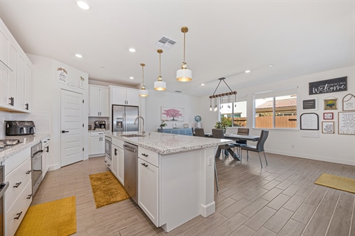 4121 Trinity Alps Way Roseville CA 95747 island and kitchen looking at pantry and windows gr15