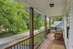 Be greeted by a delightful covered front porch.