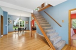 Ascend the stairs to the upper level.