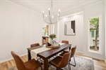 The formal dining room is adjacent to the kitchen.