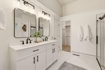 Ensuite bath with double vanity.