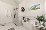 Freestanding tub and separate walk in shower.