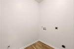 Primary bedroom with laundry room access.