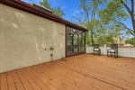 The deck overlooks the beautiful tree lined yard.