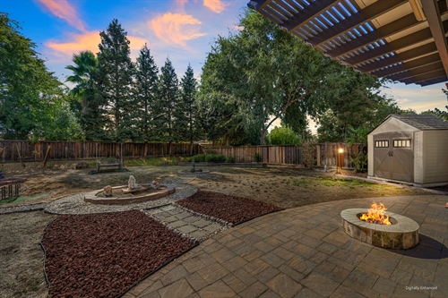 4095 Kingsbarns Drive Roseville CA 95747 backyard dusk patio to fence gr106vd