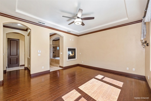 4095 Kingsbarns Drive Roseville CA 95747 primary suite with fireplace on from french door gr88