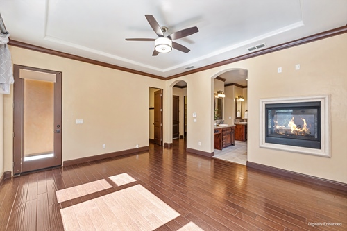 4095 Kingsbarns Drive Roseville CA 95747 primary suite bed with fireplace on facing bath gr86