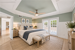 Primary Bedroom With French Doors Staged