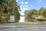 Neighborhood tidal creek boat ramp.