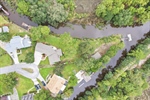 Aerial view. Lot with tidal creek on two sides.