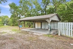 Carport or boat storage area.