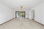Sliding doors lead to sunroom.