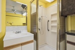 This bathroom is located off the laundry area.