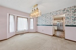 Off the kitchen is the formal dining room.