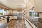 Kitchen with granite counters.