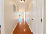 Sunlit Hardwood Hallway Perspective
