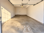 Sunlit Empty Garage with Rear Doors