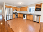 Bright Oak Kitchen with Stainless Accents