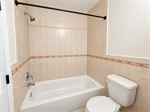 Clean Beige Tile Bathroom