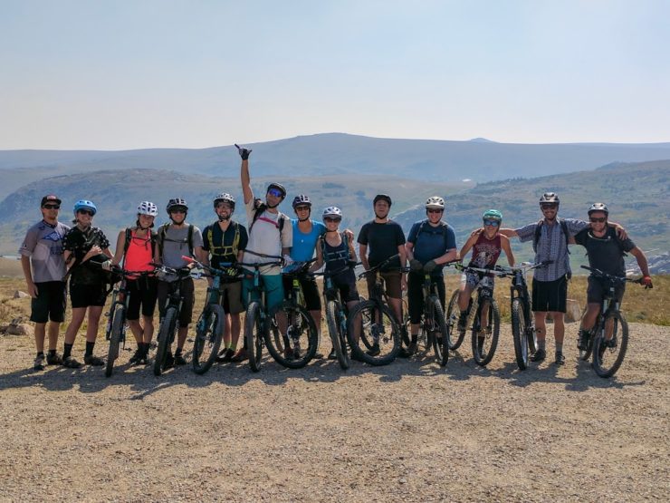Group of friends posing for a photo on the Beartooth Plateau.
