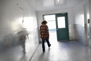 Brian Edwards walks out of a storage space where he stores his idle kitchen equipment used to produce his Higherveda Medicinals edibles line, in San Leandro, Calif. | Photo: Michael Short