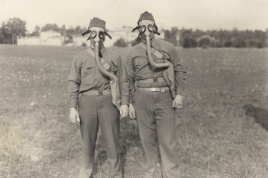 students wearing gas masks