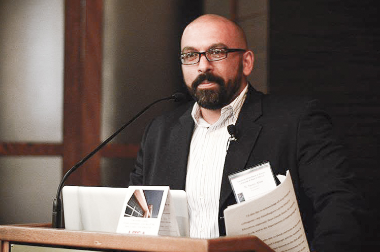 H. Samy Alim at a lectern speaking