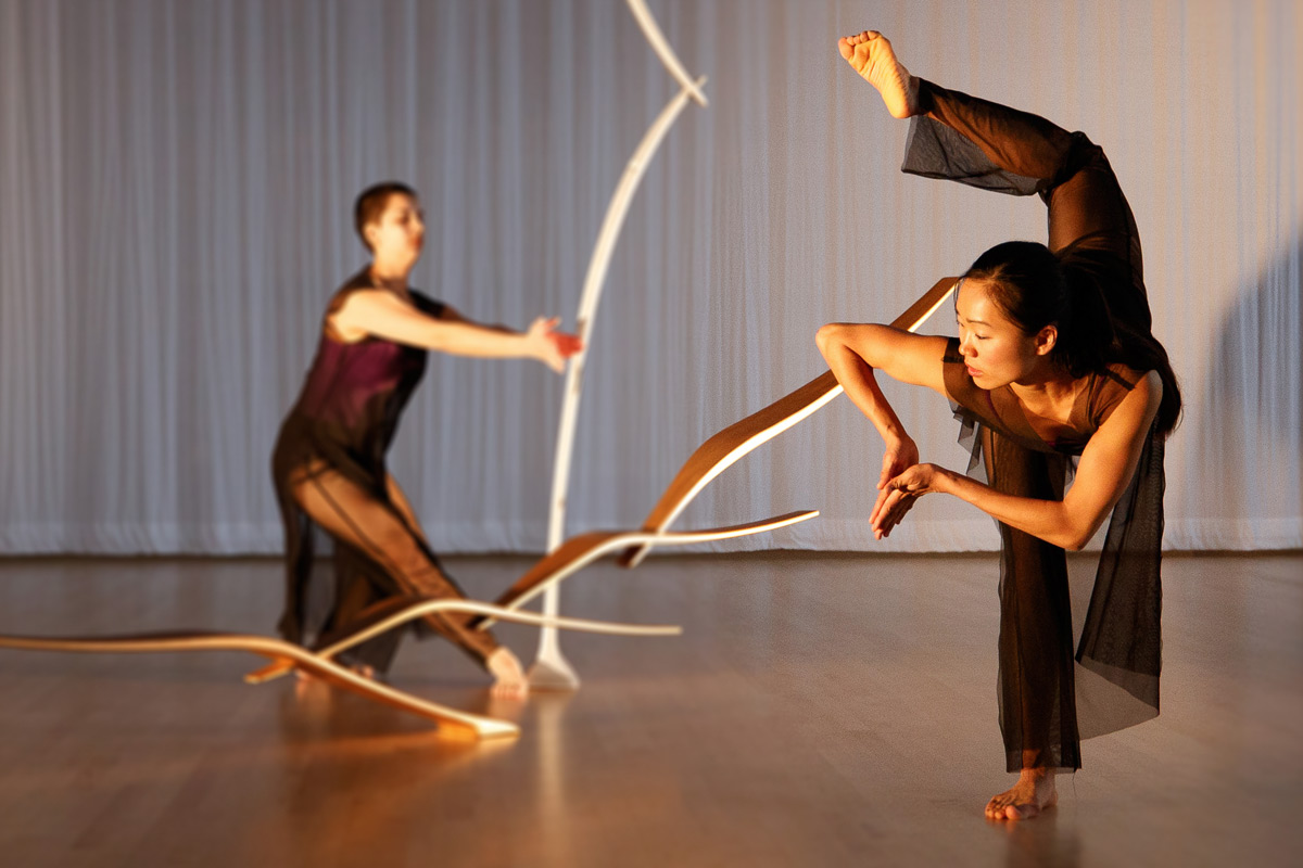 Dancers Sarah Ribeiro-Broomhead and Cora Cliburn perform "In a Winter Garden" with a sculpture by Will Clift.