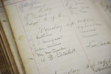 A hotel ledger with the signature of famed nature photographer Carleton Watkins is part of the sequoia collection.