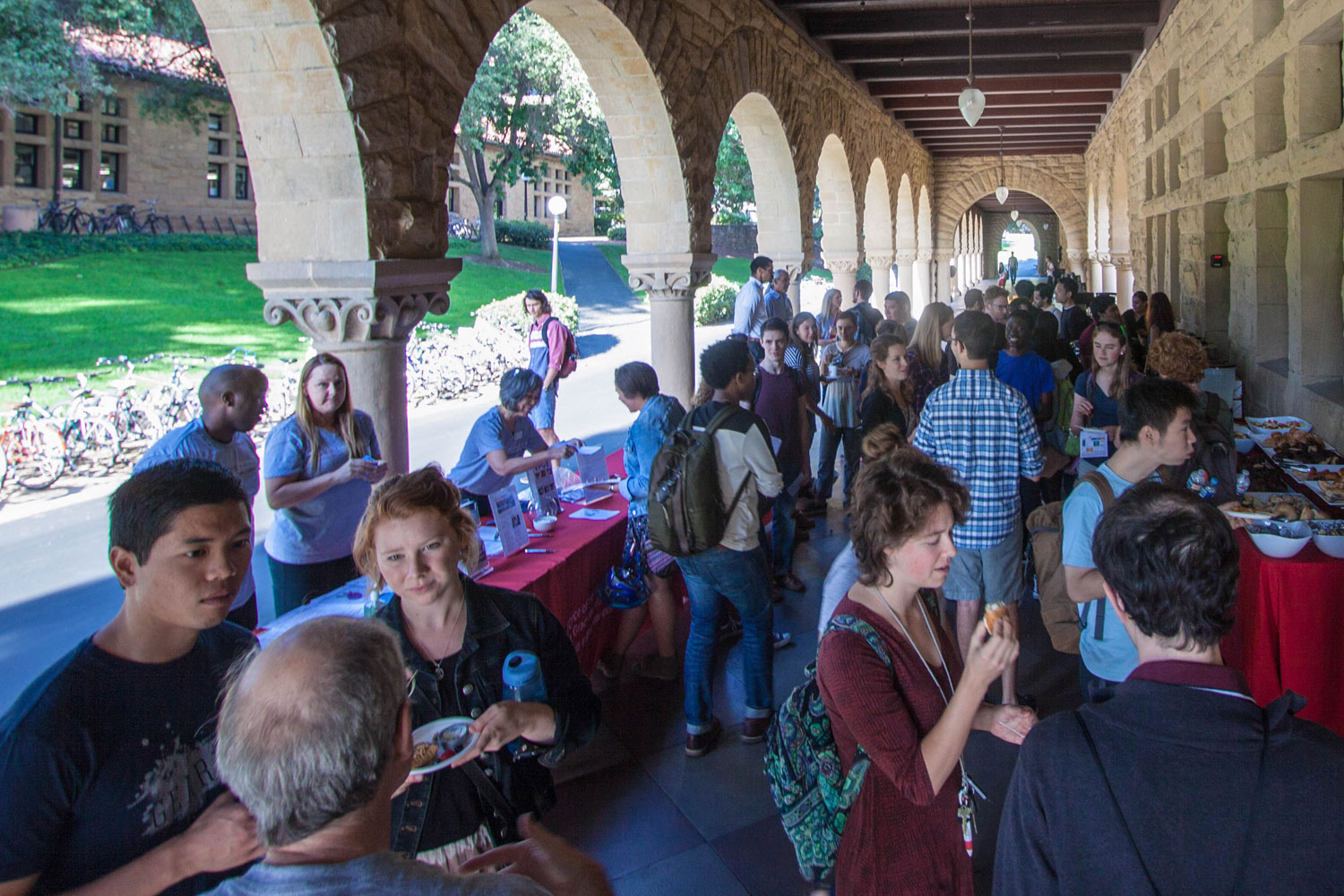 Grad students attend a resource fair in the Quad arcades sponsored by the office of the Vice Provost for Graduate Education as part of New Graduate Student Orientation.