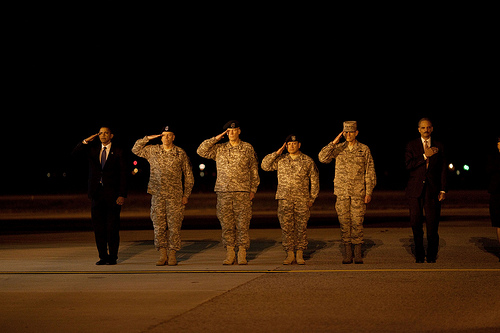 salute President Barack Obama attends a ceremony at Dover Air Force Base in Dover, Del., Oct. 29, 2009, for the dignified transfer of 18 U.S. personnel who died in Afghanistan. (Official White House Photo by Pete Souza)