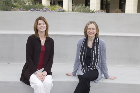Jenna Davis and Anna Michalak sitting on a bench together