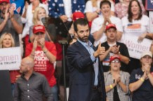 Donald Trump Jr. Poses With Assault Rifle with Hillary Clinton Behind Bars, Iron Cross