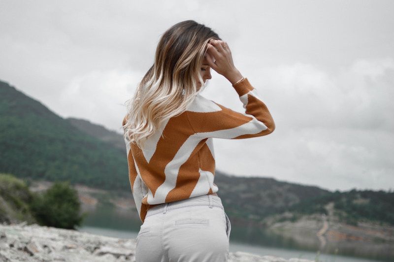 Woman wearing a fashionable striped sweater