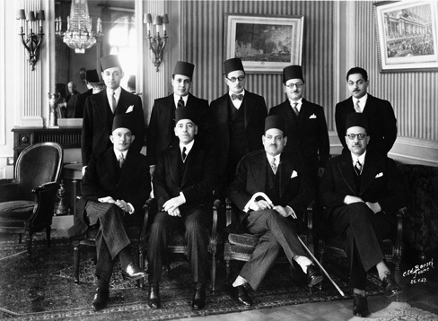 Léon Dichy (standing second on the right), member of the Egyptian Delegation to the League of Nations, with Prime Minister Mustafa Nahas Pasha (seated second on the right) on May 1937, and other dignitaries.