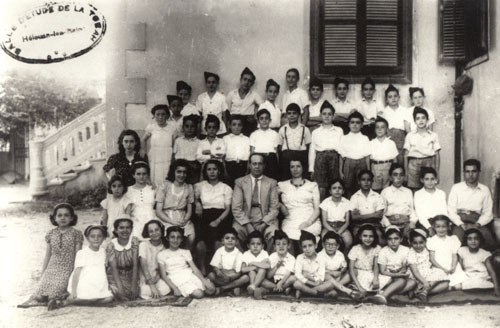 The Jewish youngsters of Helwan, learning Hebrew and Mizmorim Prayers at the “Talmud Torah”, established in Helwan by Joseph and Esther Azoulay (in the center). Helwan – 1947 (Levana Zamir private collection).