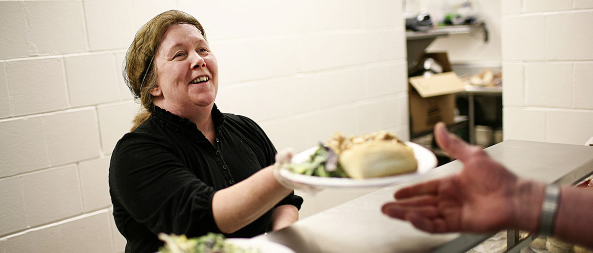 Woman Serving Food