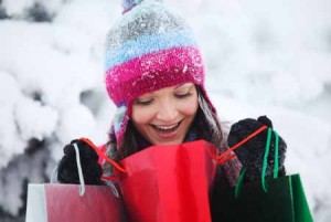 Girl Shopping and looking in bags | Shutterstock