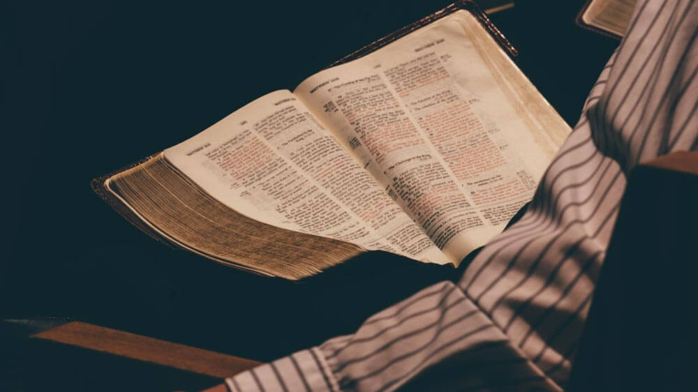 reading bible stock photo