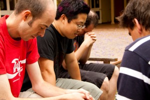 group of prayer line listeners in silent contemplation