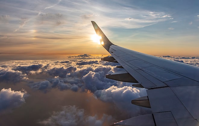 tools-and-resources-to-help-you-plan-a-trip-view-from-plane-window-of-clouds
