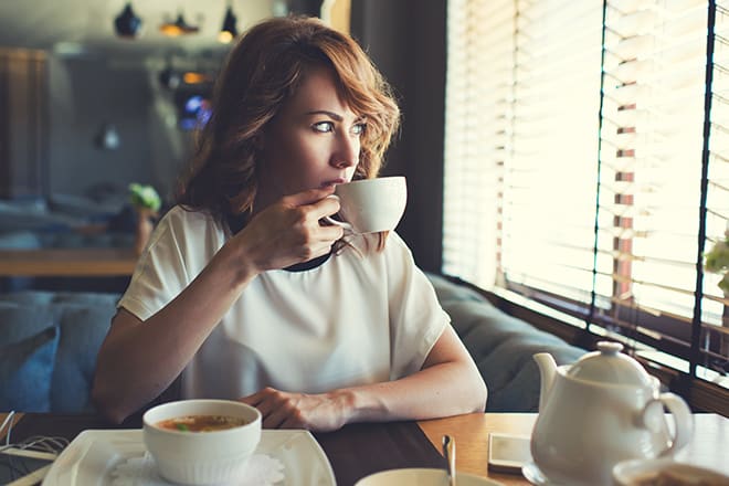 10-life-skills-every-woman-should-have-woman-sipping-tea-by-herself-peacefully