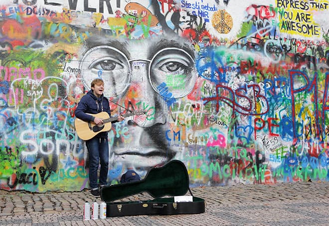 an-insta-perfect-guide-to-prague-man-plays-guitar-at-john-lennon-wall-1