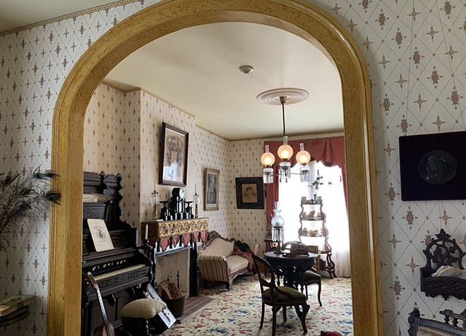historic-whaley-house-interview-americas-most-haunted-house-dean-glass-malorie-mackey-parlor-living-room-archway