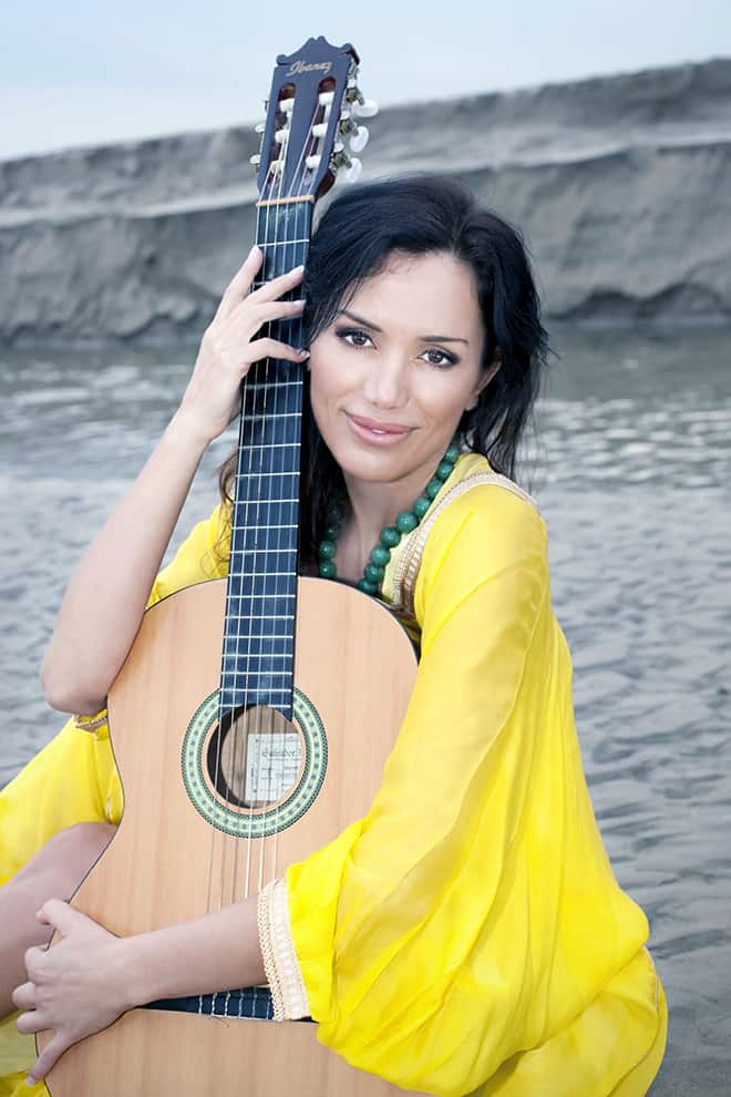 Changing-Humanity-One-Film-at-a-Time-Valentina Castellani-posing-with-guitar