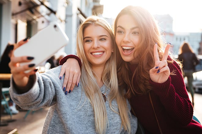 The-Glamorous-Woman’s-Guide-to-Selfie-Expressions-and-How-to-Use-Them-Properly-two-young-women-posing-for-a-selfie