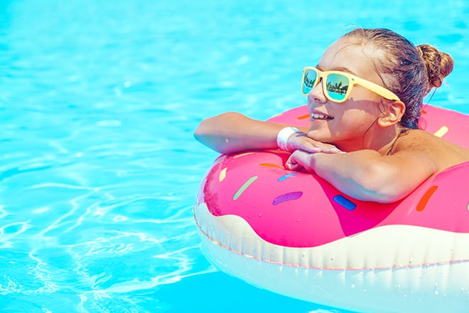 3-Ways-to-Make-the-Most-out-of-Your-Travels-girl-sunbathing-on-float-in-the-pool