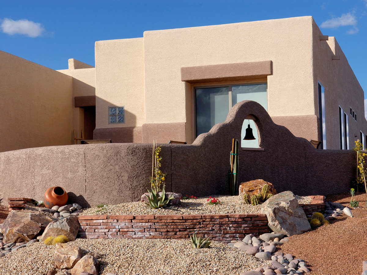 Brown boulders placed on gravel hillside