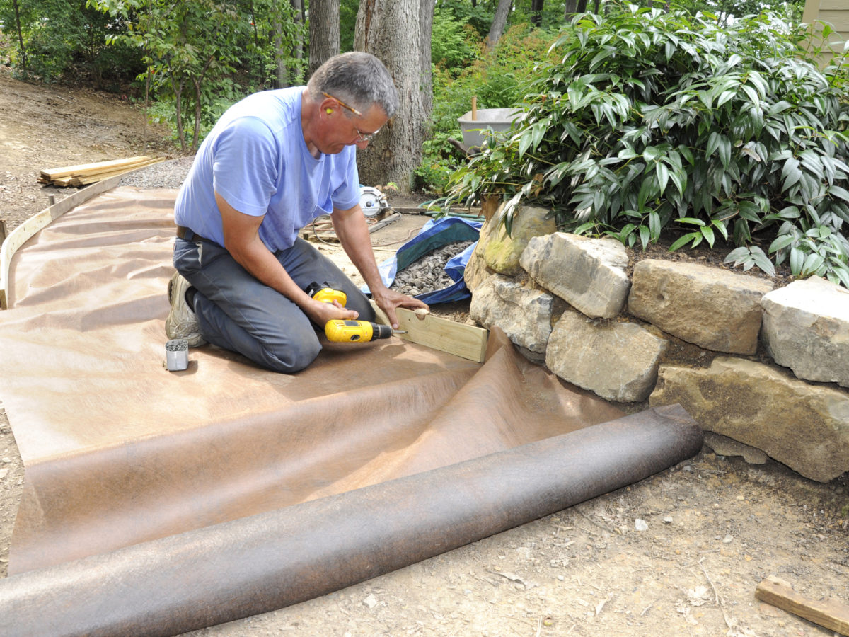 Installing weed barrier fabric for decomposed granite pathway