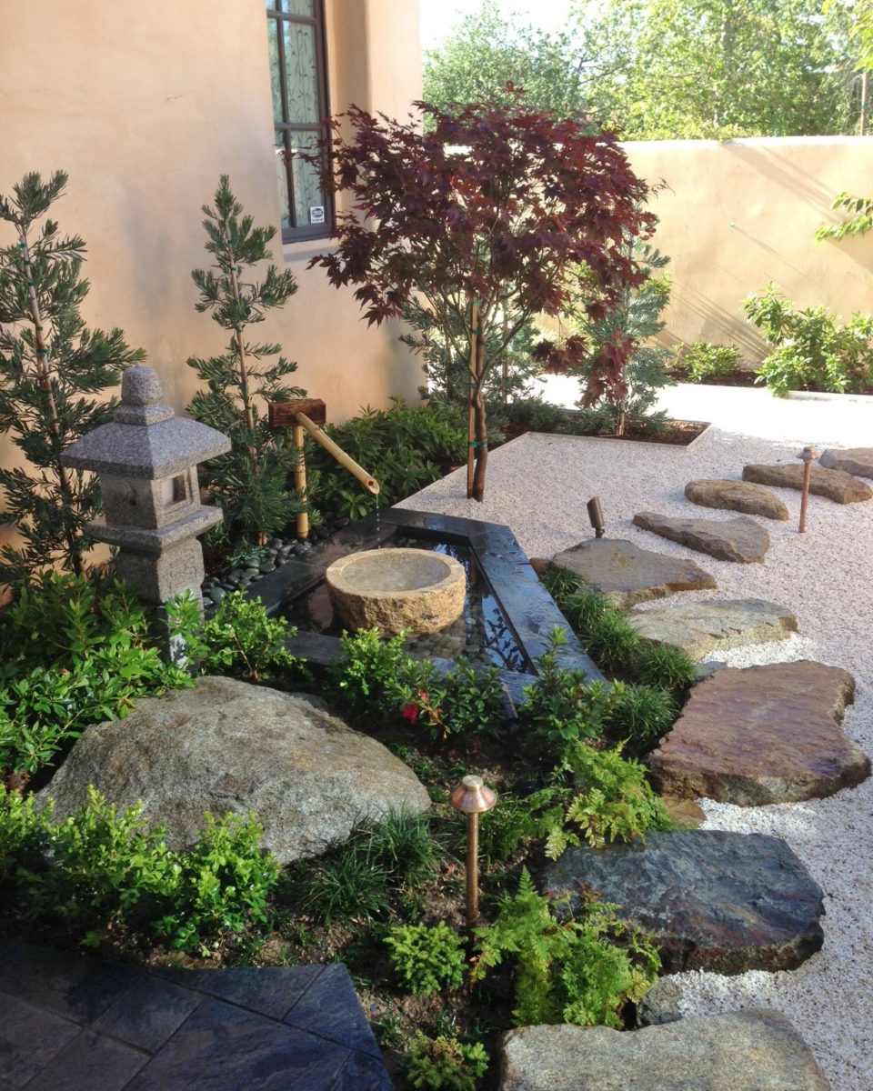 Backyard zen garden pathway with bamboo fountain and stepping stones